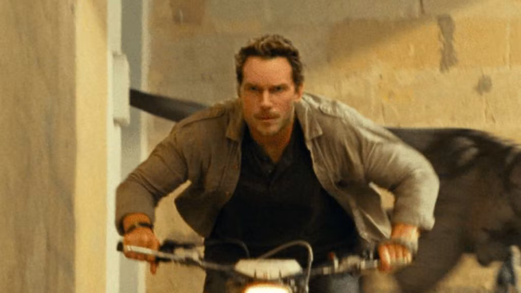 Chris Pratt Flees From An Atrociraptor In New Image From 'Jurassic World: Dominion'